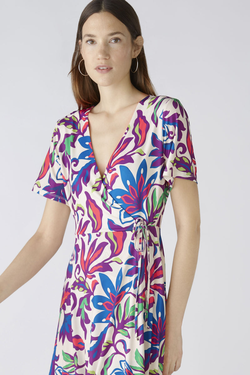 Oui Floral Wrap Dress. A tailored cut, knee length dress that wraps around and secures with a tide tide. This dress has short sleeves, a V-neckline, and bold multicoloured floral print.