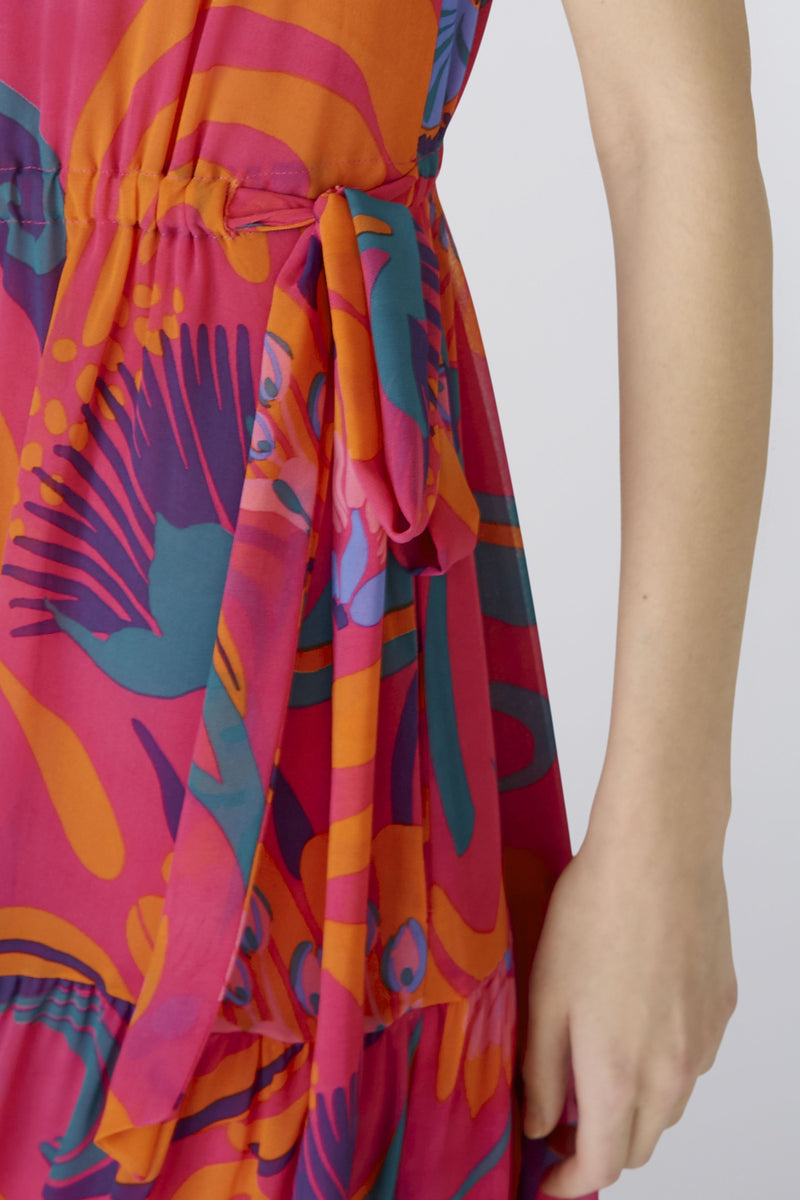 Oui Maxi Dress. A maxi length dress with all-over pink print and ruffled sleeves/neckline.