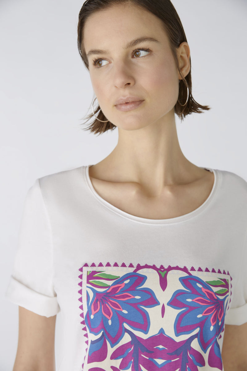 Oui Floral Motif T-Shirt. A casual cut, regular length T-shirt featuring half sleeves, a multicoloured floral motif, and slits and embroidery at the hem.