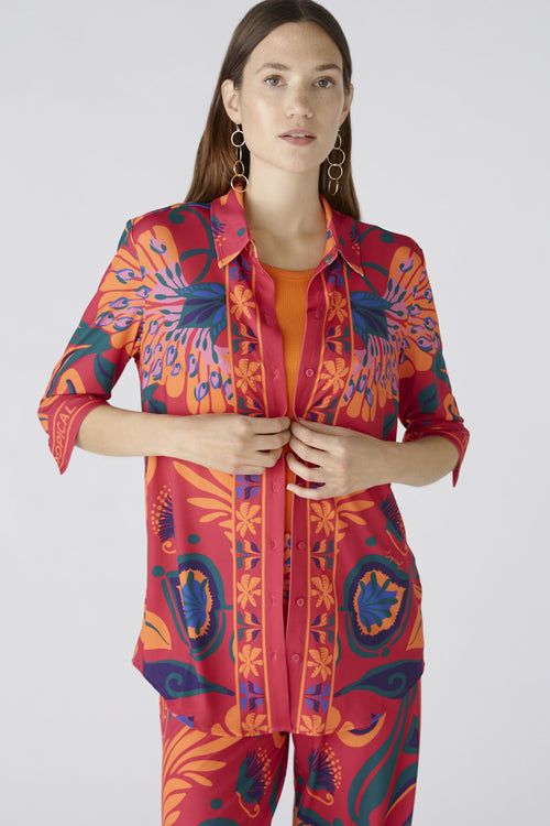 Oui Blouse. A casual cut blouse with long sleeves, shirt collar, button placket, and pink multicoloured print.