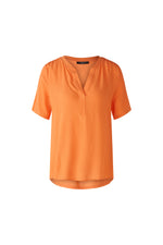 Oui V-Neck Blouse. An orange, relaxed fit blouse with short sleeves and V-neck.
