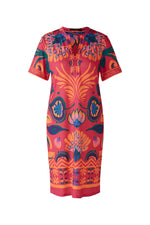 Oui Dress. An above-knee length dress with short sleeves, tunic neckline, and pink/orange all-over print.