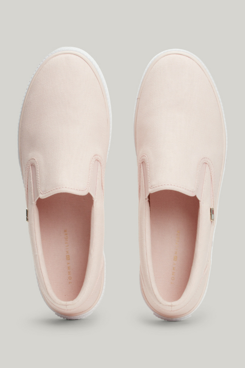 An image of the Tommy Hilfiger Enamel Flag Slip-On Canvas Trainers