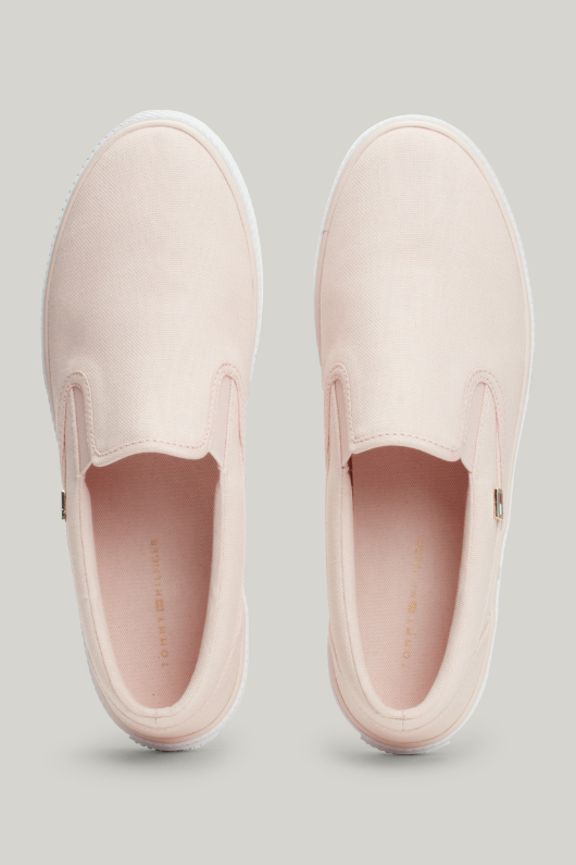 An image of the Tommy Hilfiger Enamel Flag Slip-On Canvas Trainers