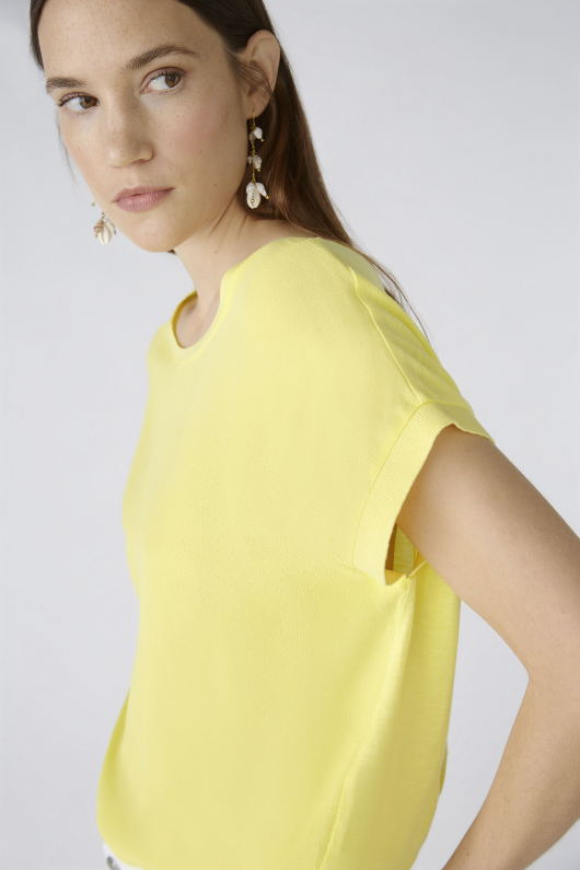 Oui Plain Cap Sleeve T-Shirt. A yellow top with short sleeves, wide neck, and split hem.