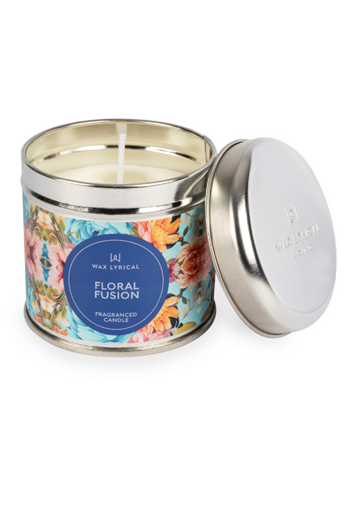 A candle with tin packaging and floral label, with notes of rose, sunflower, lily of the valley, amber, and patchouli.