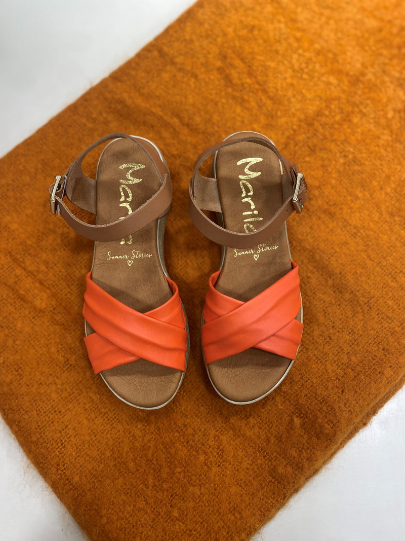 Marila Sling Back Sandal. A pair of low wedge sandals with a cross-over coral strap.