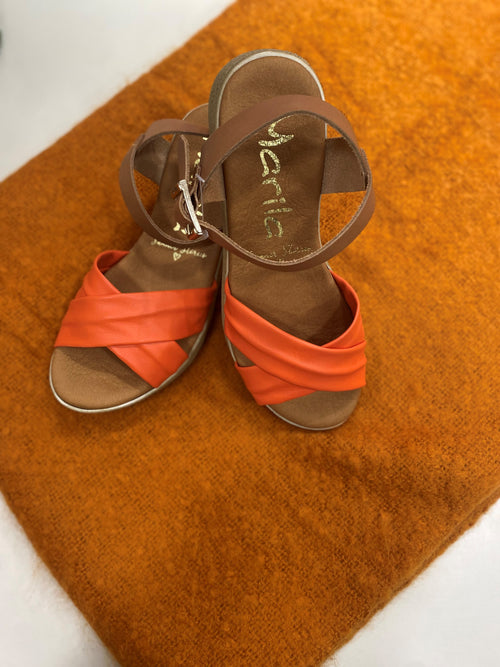Marila Sling Back Sandal. A pair of low wedge sandals with a cross-over coral strap.