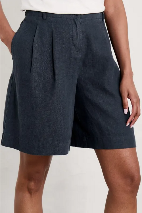 An image of a model wearing the Seasalt Clover Bloom Shorts in the colour Maritime.