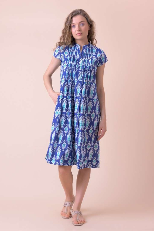 An image of a female model wearing the Handprint Dream Apparel Lacey Dress in the colour Farsi Blue.