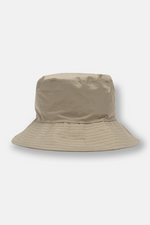 Lighthouse Storm Rain Hat. A completely waterproof bucket hat with a wide brim, a woven check lining, and a chic fawn green design.
