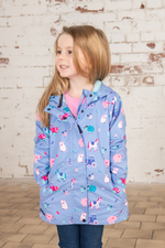 Lighthouse Olivia Jacket. A lightweight, waterproof kids coat with a soft jersey lining, two front pockets, a zip-up front, and a cute farm animal design on a lilac background.