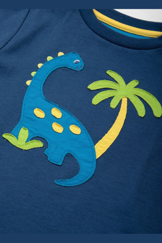 Kite T-Shirt. A short sleeve, round neck T-shirt. This top is navy and has a dinosaur applique.