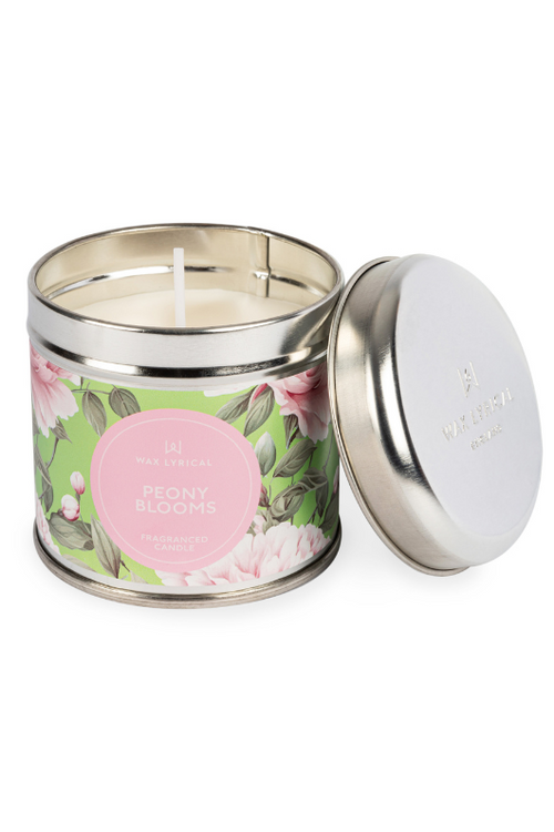 A candle with tin packaging and floral label, with notes of peony, rose, mandarin, and amber.