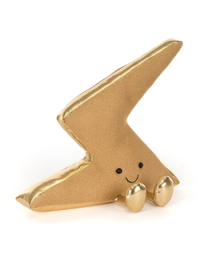 Gold lightning bolt-shaped figurine with a smiling face on a white background