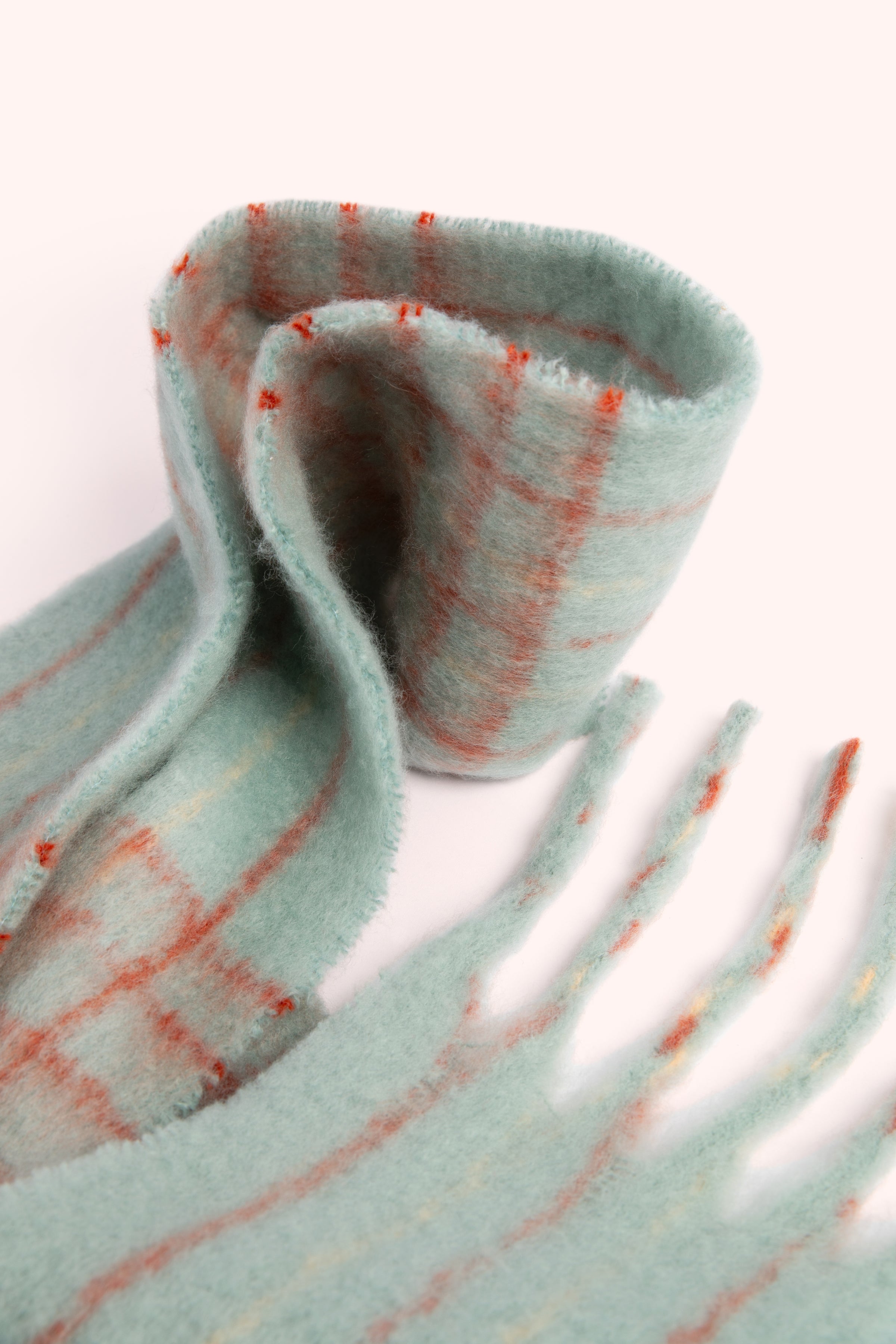 An image of the Powder Angelica Cosy Scarf - Ice/Tangerine