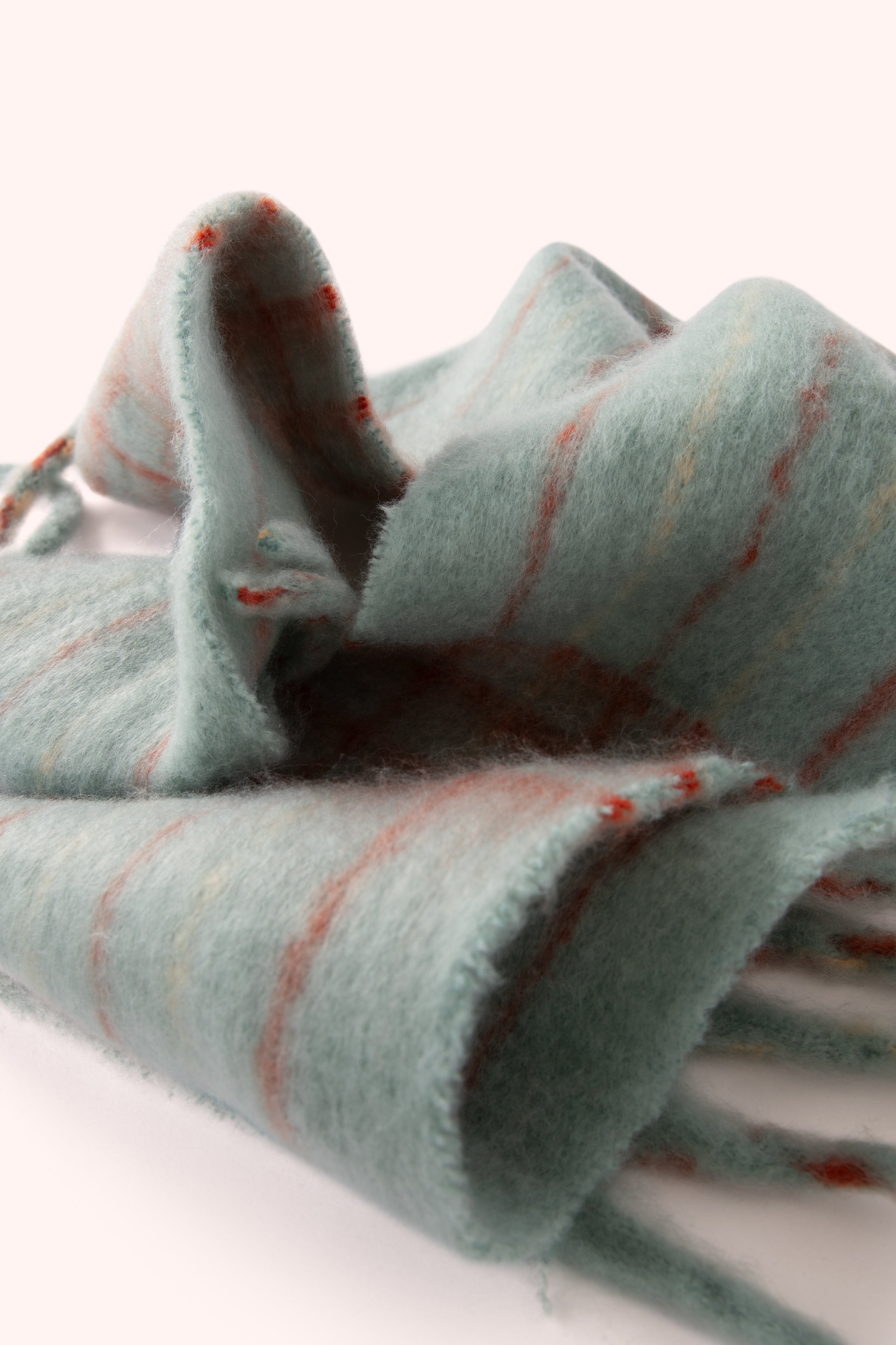 An image of the Powder Angelica Cosy Scarf - Ice/Tangerine