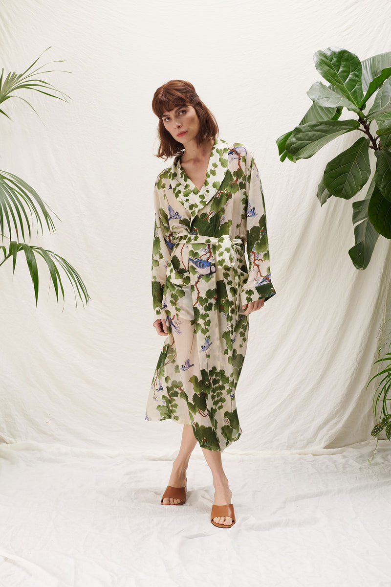 One Hundred Stars Acer Green Gown. A cosy, midi-length dressing gown with a belt tie at the waist, long sleeves, and an all-over intricate design.