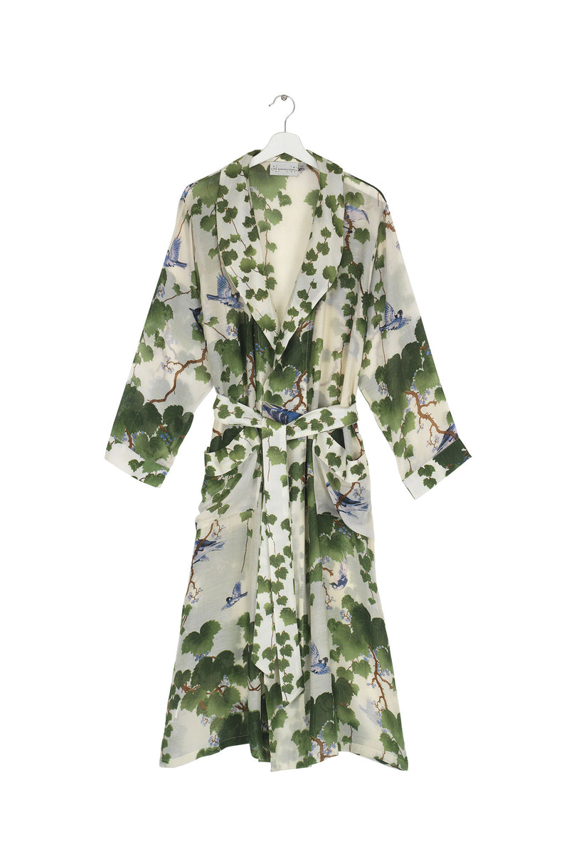 One Hundred Stars Gown. A long kimono-style gown with a belted waist and a leafy green design.