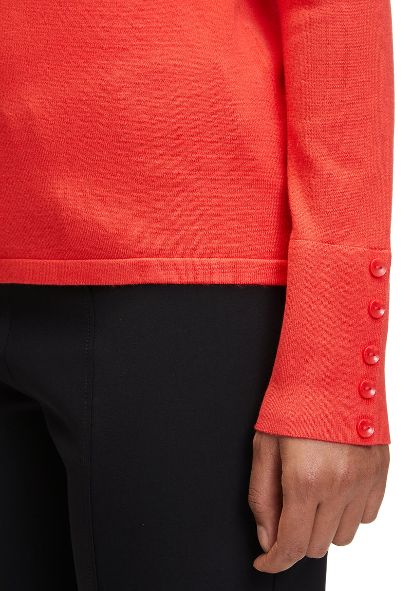 An image of the Betty Barclay Fine Knit Top in red, with long sleeves featuring a button detail.