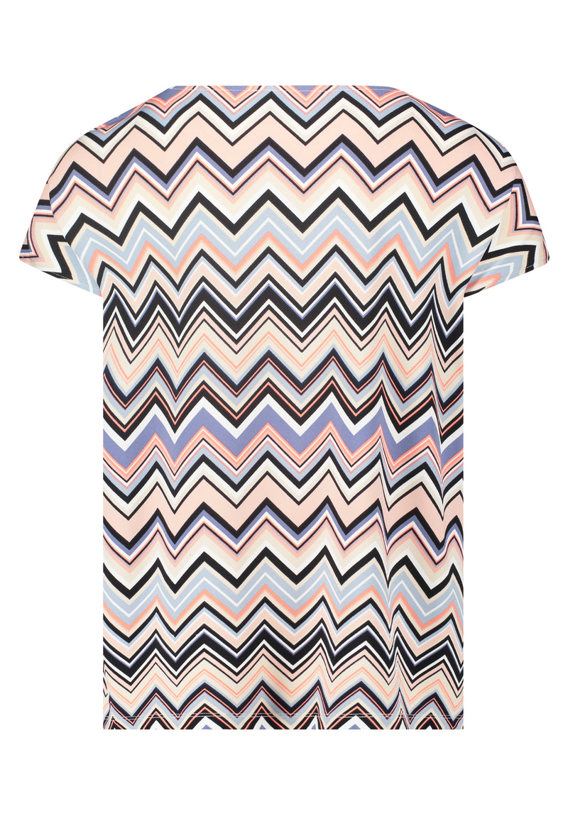 This Betty Barclay Printed Top has a figure-skimming design, dropped mid-length sleeves and a cowl neckline. It features a zig-zag pattern in multiple pastel colours including blue and pink. 