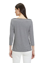 This Betty Barclay Striped Top has a bateau neckline and 3/4 length sleeves. This top is slightly fitted and has a dark blue and white striped pattern.