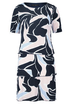 Betty Barclay Tiered Dress. A knee-length straight fit dress, with mid-length sleeves. This dress features an abstract print with pastel blue and pink accents on a navy background.