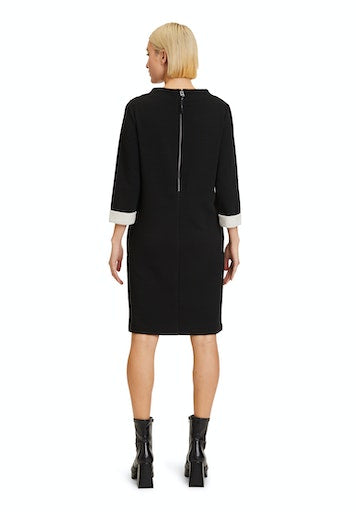 An image of the Betty Barclay 3/4 Sleeve Dress in black with contrasting sleeve cuffs.