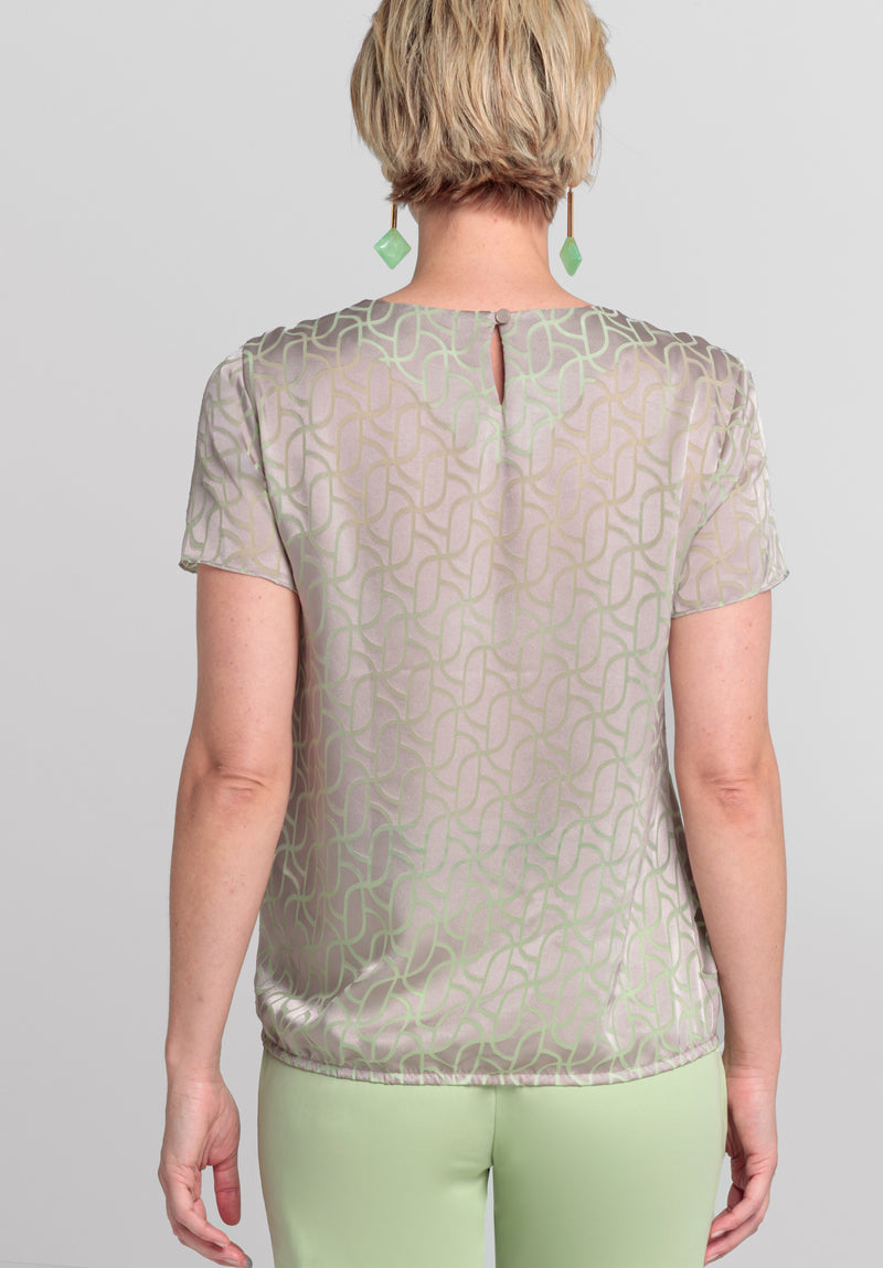 Bianca Darin Blouse. A short sleeve satin finish blouse with subtle print in beige mix.