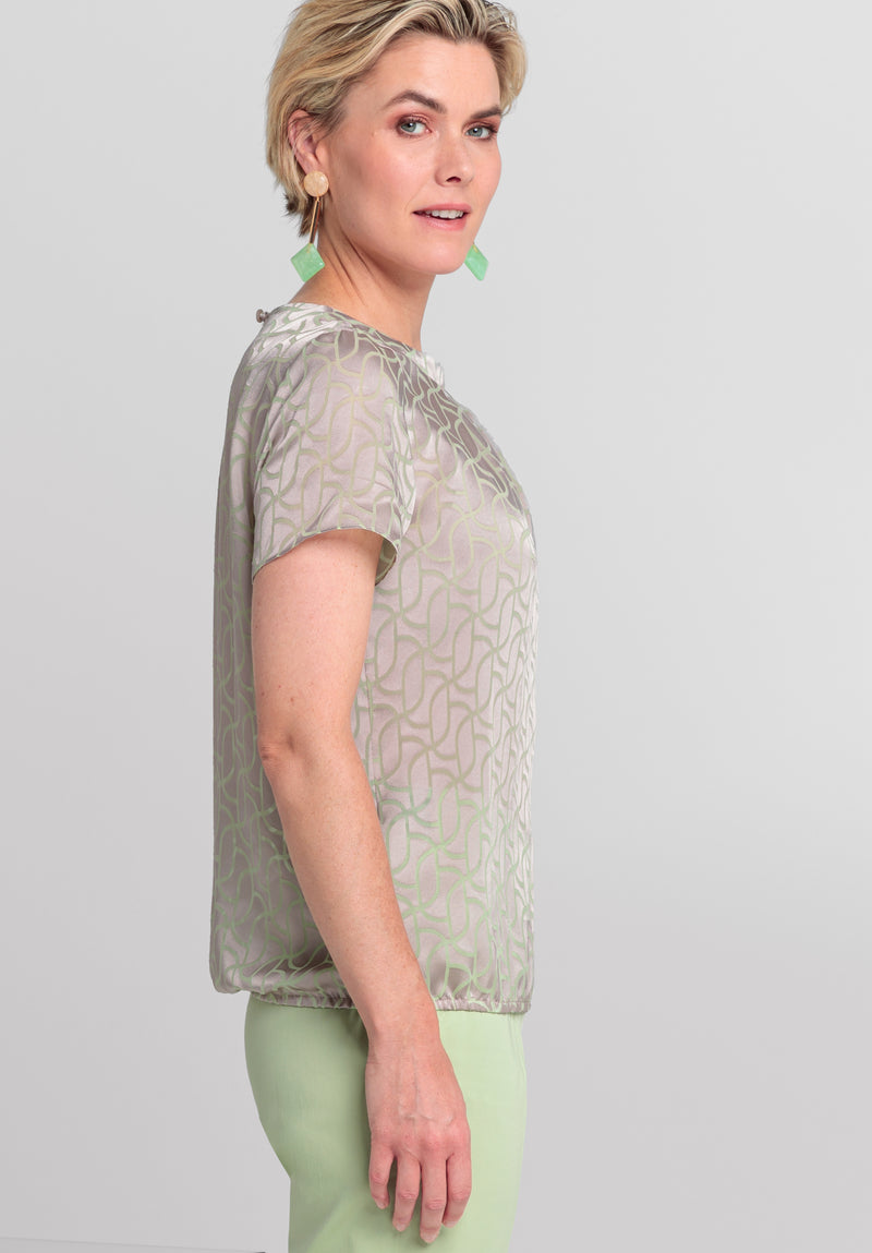 Bianca Darin Blouse. A short sleeve satin finish blouse with subtle print in beige mix.