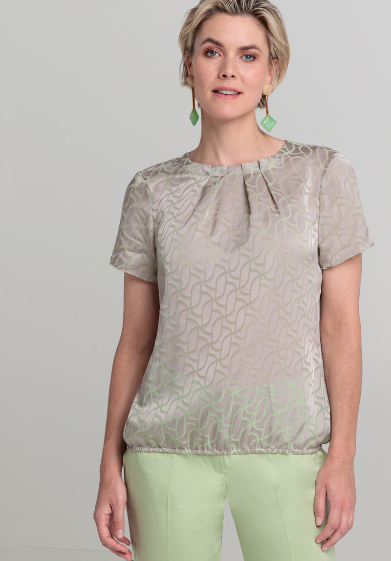 Bianca Darin Blouse. A short sleeve satin finish blouse with subtle print in beige mix.