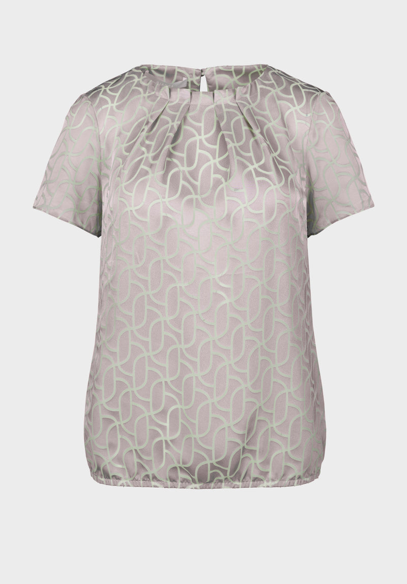 Bianca Darin Blouse. A short sleeve satin finish blouse with subtle print in beige mix.