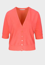 Bianca Oriain Short Sleeve Cardigan. A regular fit short sleeve cardigan with V-neck and button fastenings. This cardigan has a cropped length and is a coral pink colour.