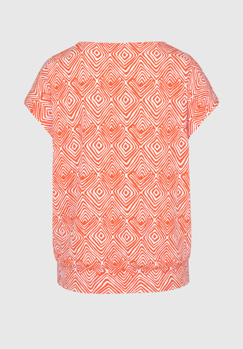 Bianca Julie Top. A casual fit top with short sleeves and round neckline, featuring a unique orange print.