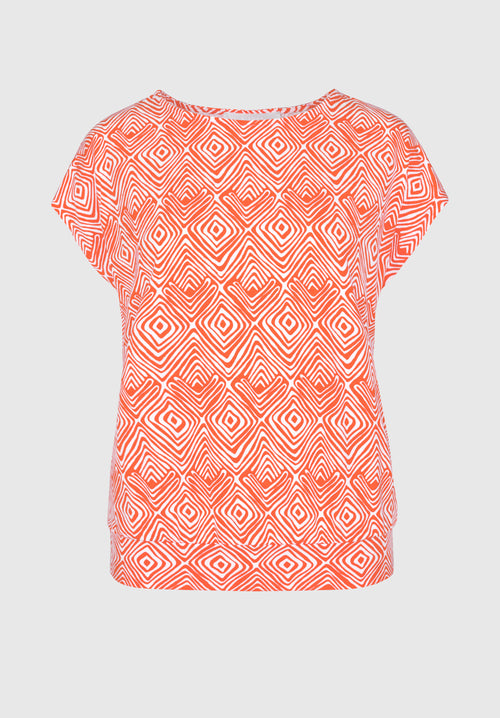 Bianca Julie Top. A casual fit top with short sleeves and round neckline, featuring a unique orange print.