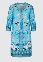 Bianca Danilo 3/4 Sleeve Patterned Dress. A relaxed fit dress with 3/4 length sleeves, knee-length design, and V-neckline. This dress has a vibrant blue pattern.