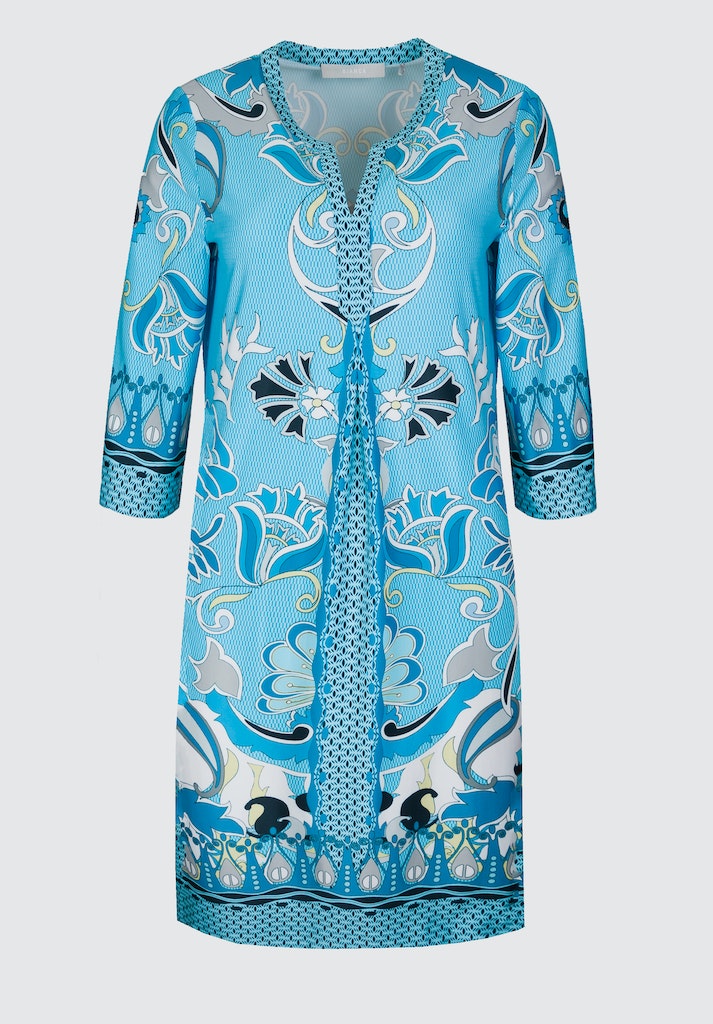 Bianca Danilo 3/4 Sleeve Patterned Dress. A relaxed fit dress with 3/4 length sleeves, knee-length design, and V-neckline. This dress has a vibrant blue pattern.