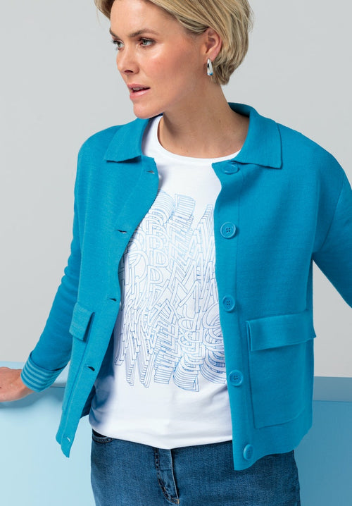 Bianca Ranis Knit Jacket. A regular fit, long sleeve knit jacket with collared neckline and button fastenings. This jacket is cornflower blue and has pockets and striped cuff detail.