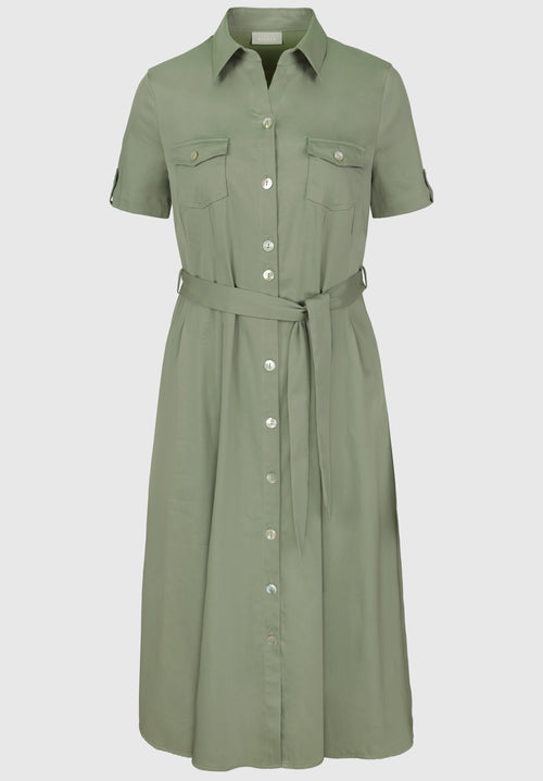 Bianca Shirt Henrika Dress. A green midi length dress with short sleeves, shirt collar, belt, and button fastenings.