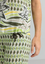 Bianca Arwen Drawstring Blouse. A short sleeve blouse with round neck and drawstring hem, featuring a bold print.