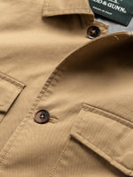 Rodd & Gunn Whitstone Jacket. A beige long sleeve jacket with water-repellent finish, long sleeves and chest pockets.