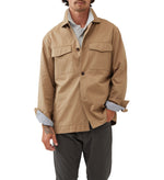 Rodd & Gunn Whitstone Jacket. A beige long sleeve jacket with water-repellent finish, long sleeves and chest pockets.