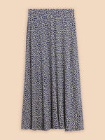 White Stuff Jada Eco Vero Skirt. A maxi skirt with flowy style and an all-over white dotted design on a navy background.