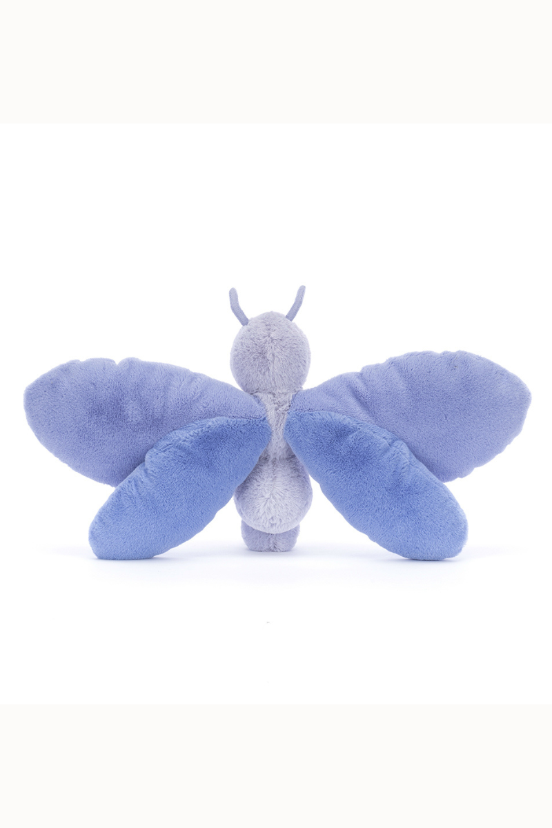 Jellycat Bluebell Butterfly. A soft toy butterfly with indigo and lavender wings, smiling face, and feelers.