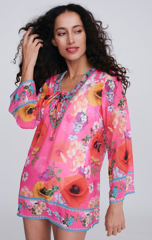 Pia Rossini Copacabana Cover Up. A midi length, long sleeve cover up made from lightweight material. This cover up has dazzling embellishment and pink floral print.