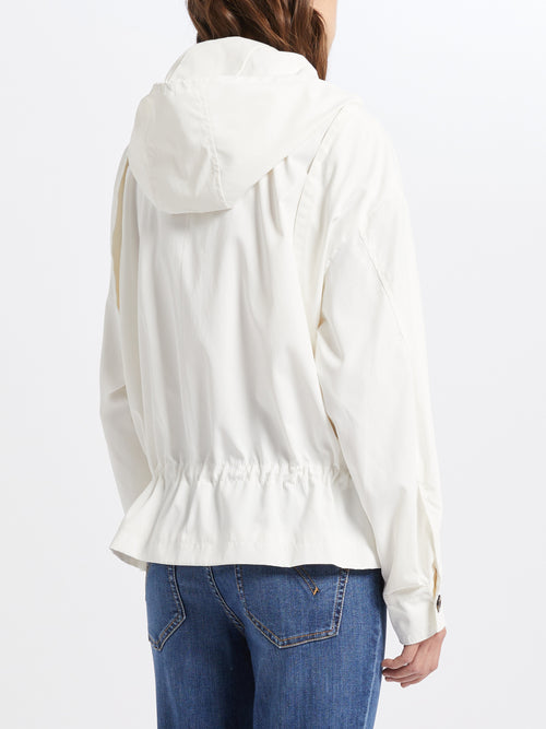 Marella Scrigno Raincoat. A flared fit white raincoat with high neck, gathered hem, drawstrings and zip closure, made from a water repellent material.