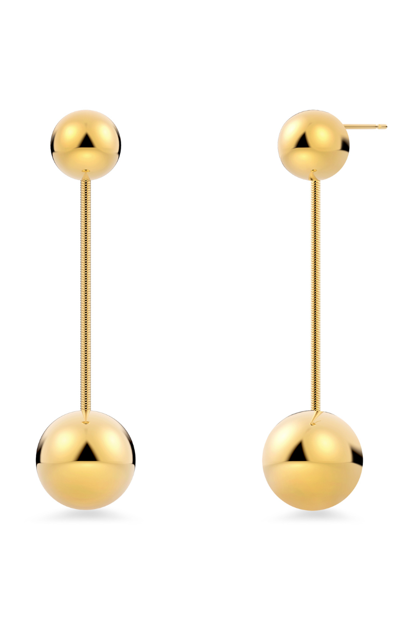 Edblad Diego Earrings. A pair of gold plated dangly earrings with spherical shape design.