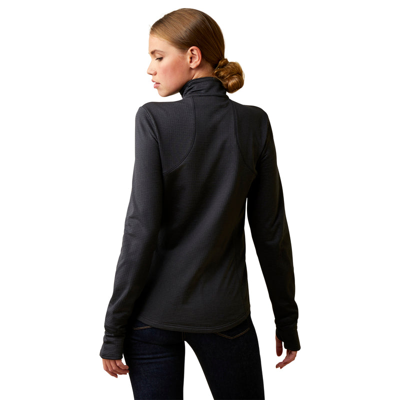 An image of a female model wearing the Ariat Gridwork 1/4 Zip Baselayer in the colour Black.