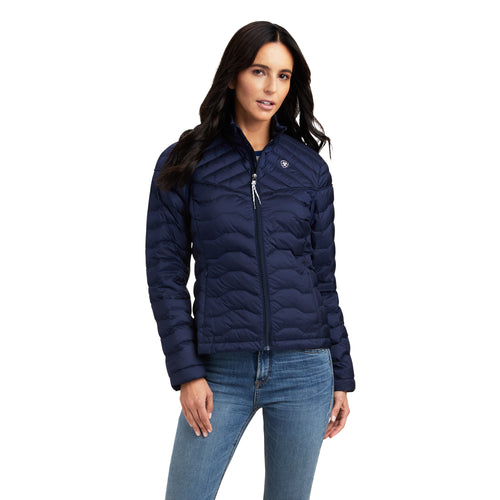 An image of a female model wearing the Ariat Ideal Down Jacket in the colour Navy Eclipse.