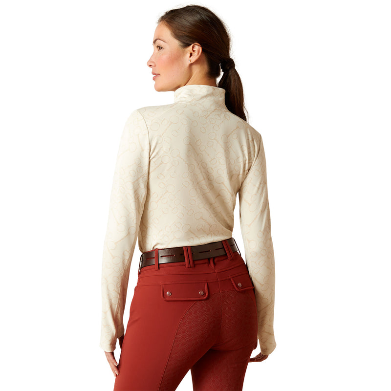 An image of a female model wearing the Ariat Prophecy 1/4 Zip Baselayer in the colour Petrified Oak.